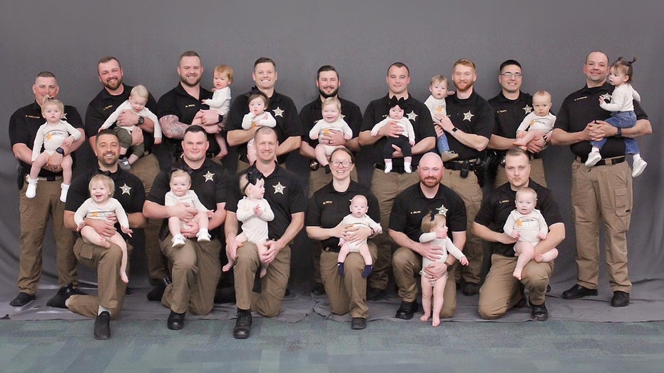 Sheriff’s office celebrates major ‘baby boom’ as law enforcement poses for sweet photo with their 15 kids