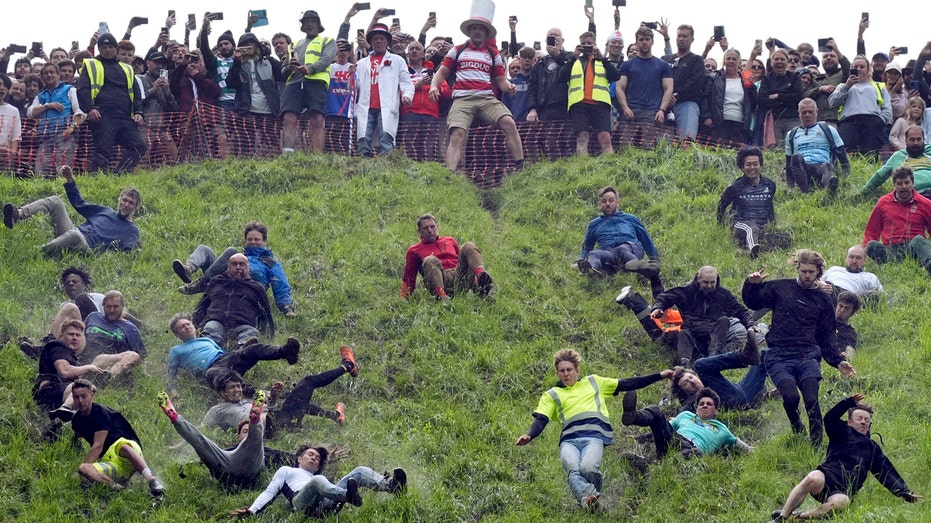 Annual cheese rolling race attracts thousands to England’s Cooper’s Hill