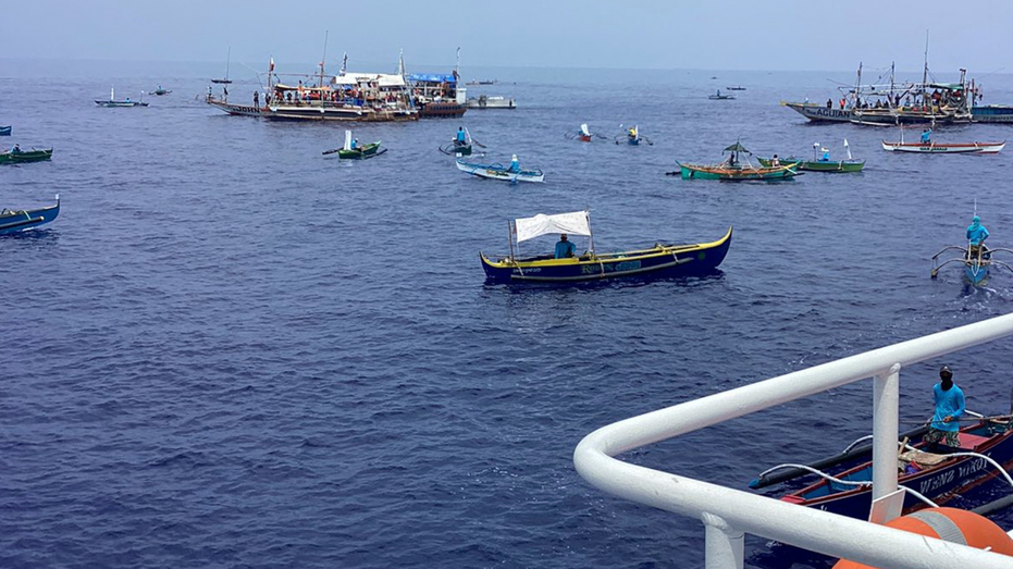 China’s military monitors route taken by Filipino activists sailing toward disputed shoal