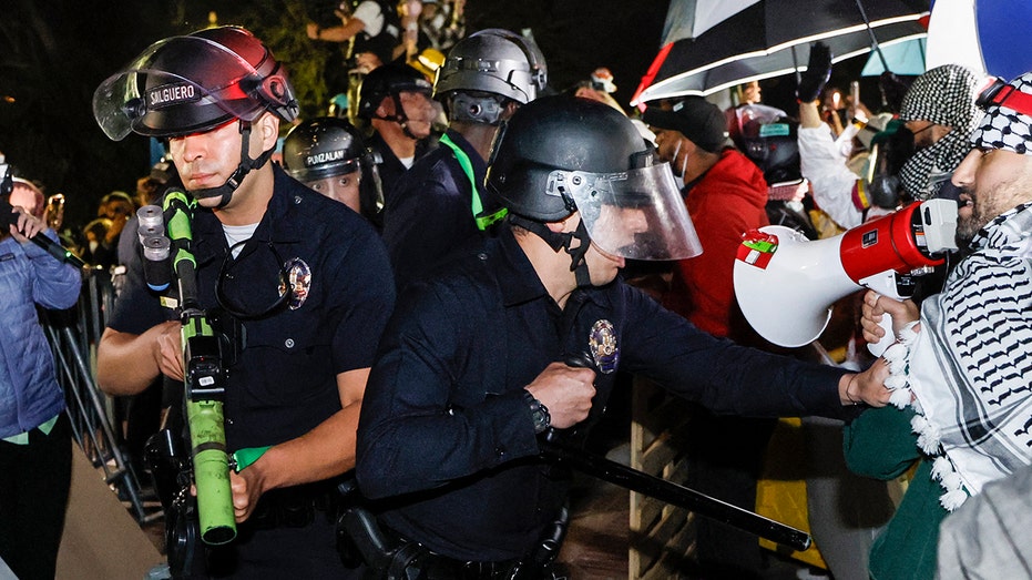 Police at UCLA face off against left-wing mob, fortified encampment as campus anti-Israel protests escalate