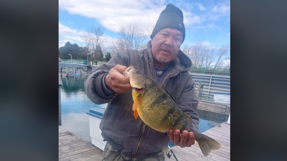Angler breaks 43-year-old record after reeling in large perch in Lake Michigan