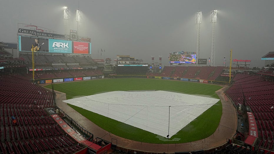 MLB grounds crew member gets trapped under tarp in rain delay