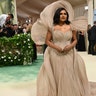 Mindy Kaling wears layers of silky to the Met Gala in New York.