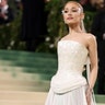 Ariana Grande at the Met Gala 2024 red carpet in a corseted custom Loewe dress.