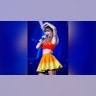 Taylor Swift embraced bright colors when she wore a dark orange crop top and light orange skirt while performing in Madrid during her stop in Spain for the Eras Tour.