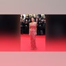 Demi Moore walked the red carpet at the 2024 Cannes Film Festival in a sequined red Giorgio Armani Privé gown with floral designs.