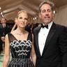 Jerry Seinfeld and his wife Jessica Seinfeld at the Met Gala 2024 red carpet in a black suit and black and white dress.