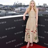 Dakota Fanning promoted her new movie, "The Watched," in a beige Oscar de la Renta dress with tulip designs on the bottom.