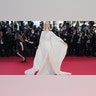 Elle Fanning at the Cannes Film Festival in a flowy sheer Gucci gown with a plunging neckline and open back.