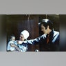 Elvis, Priscilla and Lisa Marie Presley enjoying time outside.