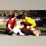 Priscilla and Elvis Presley with their daughter and a dog