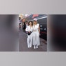 Heidi Klum and her daughter Leni Klum attended the F1 Grand Prix of Monaco in matching white outfits. Heidi wore an Alaa two-piece midriff-bearing set with circular cutouts, while Leni wore a white jumpsuit with gold buttons.