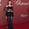 Leni Klum walked the carpet at the amfAR Gala in a sheer knit dress with 3D floral embellishments on the bust and hips.