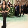 Kendall Jenner at the Met Gala 2024 red carpet in a black Givenchy Haute Couture sheer gown.