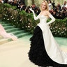 Actress Nicole Kidman wears a strapless white gown with black lace skirt to Met Gala in New York.