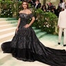 Penelope Cruz at the Met Gala 2024 red carpet in a black lace Chanel Haute Couture.