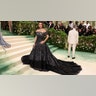 Penelope Cruz at the Met Gala 2024 red carpet in a black lace Chanel Haute Couture.