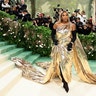 Serena Williams sports gold at the Met Gala red carpet.