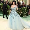 Sydney Sweeney at the Met Gala 2024 red carpet in a powder blue gown and black hair.
