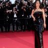 Salma Hayek walked the red carpet at the premiere of "Emilia Perez" at Cannes Film Festival, in a black figure-hugging strapless Saint Laurent gown.