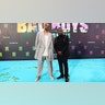 Will Smith and Martin Lawrence posed for pictures together at the premiere of "Bad Boys: Ride or Die." Lawrence wore a black suit with embelishments on the shoulders, while Smith wore a gray suit with an oversized jacket.