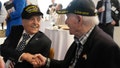 World War II veterans Andy Negra, left, and Hilbert Margol, speak to each other during an an event honoring the two on March 14, 2024, in Atlanta. Margol is a 100-year-old World War II veteran living in Dunwoody, Georgia.