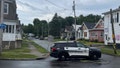 Police investigate the scene of Friday nights shooting in Utica, N.Y., early Saturday, June 29, 2024. An officer shot and killed a teen fleeing while pointing a replica gun, police said Saturday.