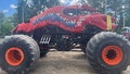 This photo provided by the Topsham Police Department shows a lobster-themed monster truck that clipped an aerial power line, toppling several utility poles while performing for a crowd at the Topsham Fairgrounds on Saturday, June 1, 2024.