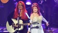 LAS VEGAS, NV - OCTOBER 07:  Recording artists Wynonna Judd (L) and Naomi Judd perform during the launch of their nine-show residency "Girls Night Out" at The Venetian Las Vegas on October 7, 2015 in Las Vegas, Nevada.  (Photo by Mindy Small/FilmMagic)