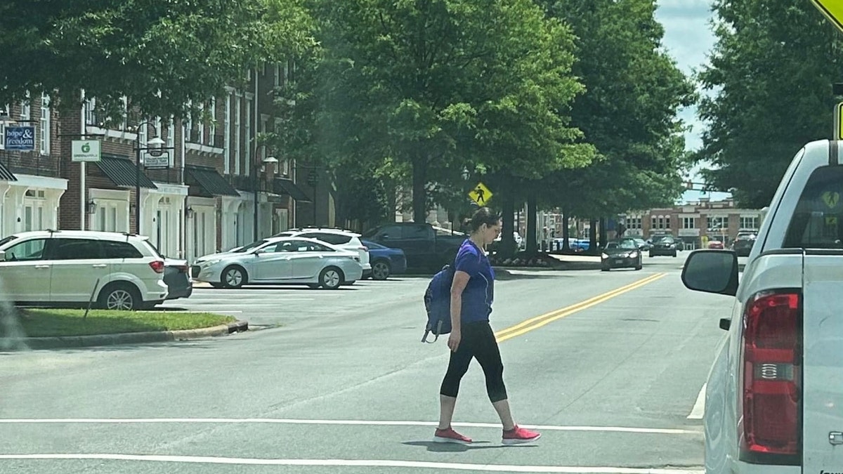 Diana Cojocari walking in downtown Cornelius