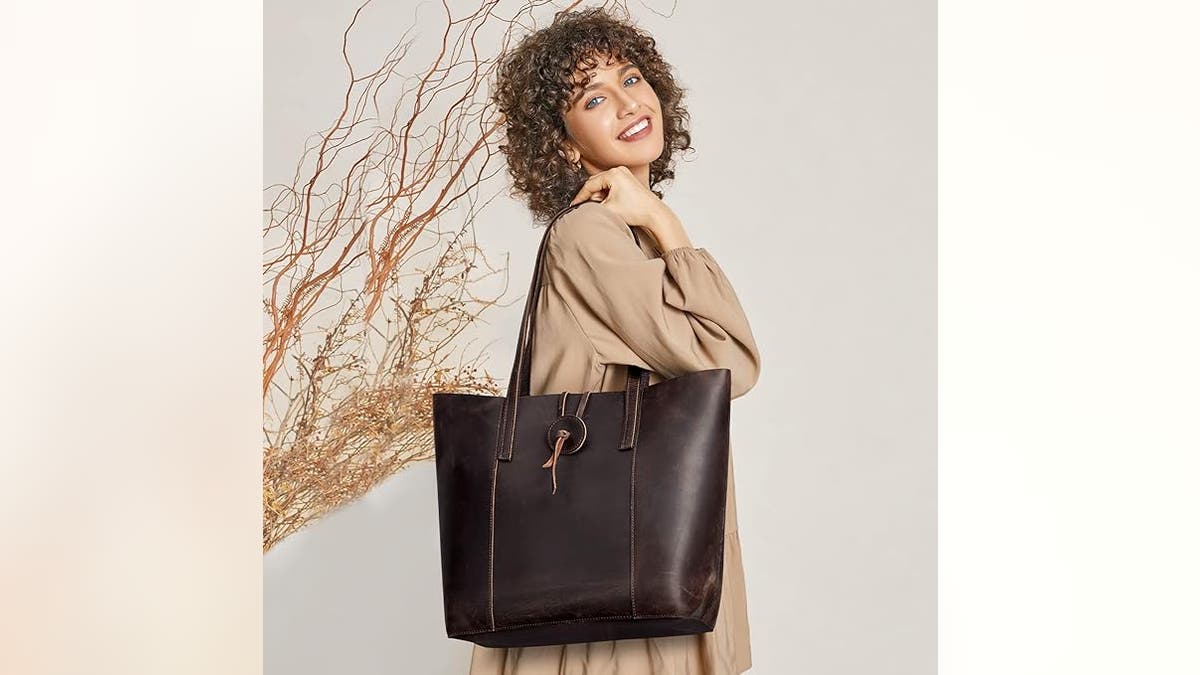 A leather bag helps you carry all your items in style. 