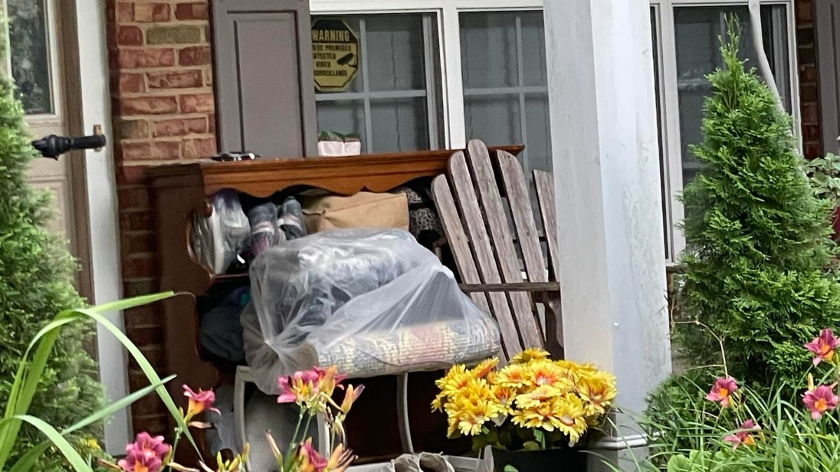 Diana Cojocari and Christopher Palmiter's front porch covered with clutter