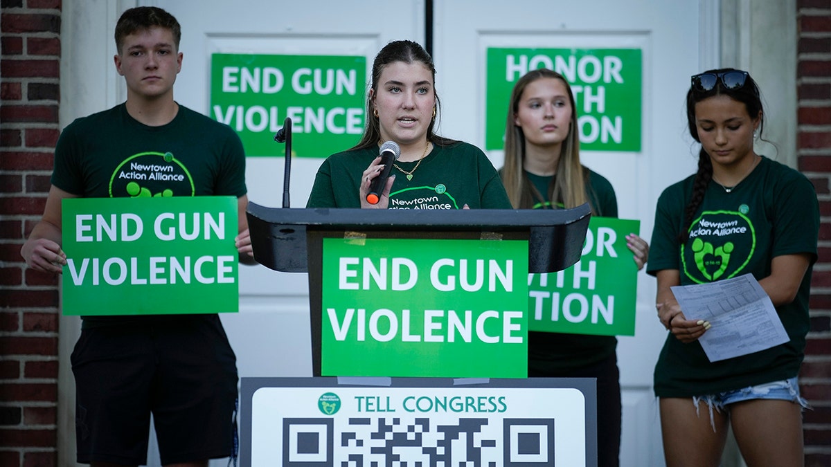emma ehrens speaks at a rally against gun violence