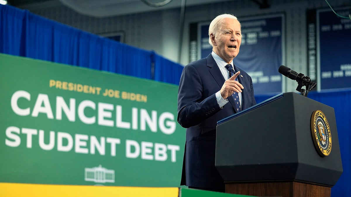 Biden pointed on stage in Madison during a student loan relief event