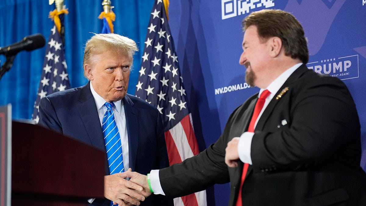 Trump shakes hands with the chairman of the Nevada Republican Party