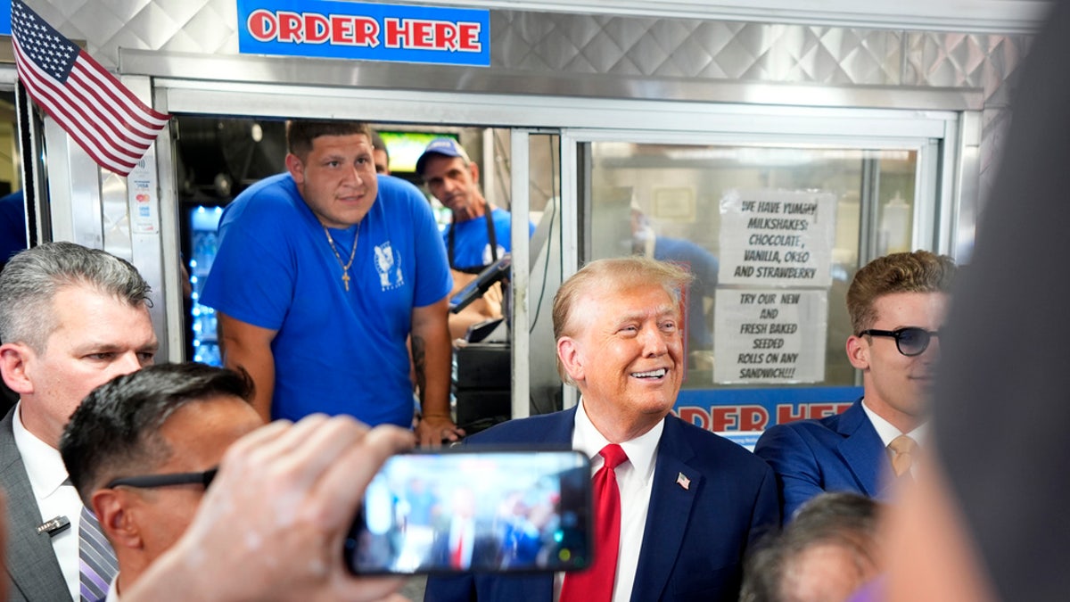 Trump greets people at a Philadelphia sandwich shop