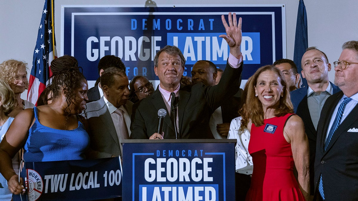 Latimer waves to supporters after victory 