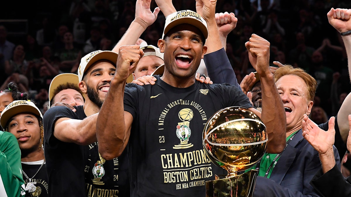 Al Horford smiles with trophy