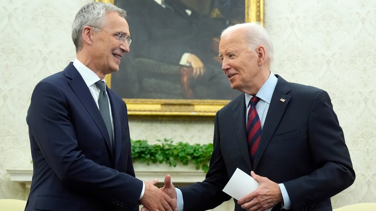 President Joe Biden shakes hands with NATO Secretary General Jens Stoltenberg in the Oval Office.