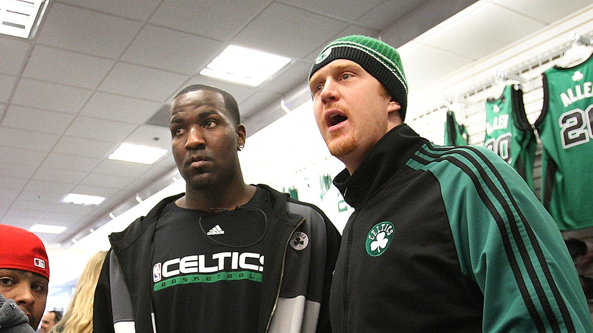 Kendrick Perkins and Brian Scalabrine look on