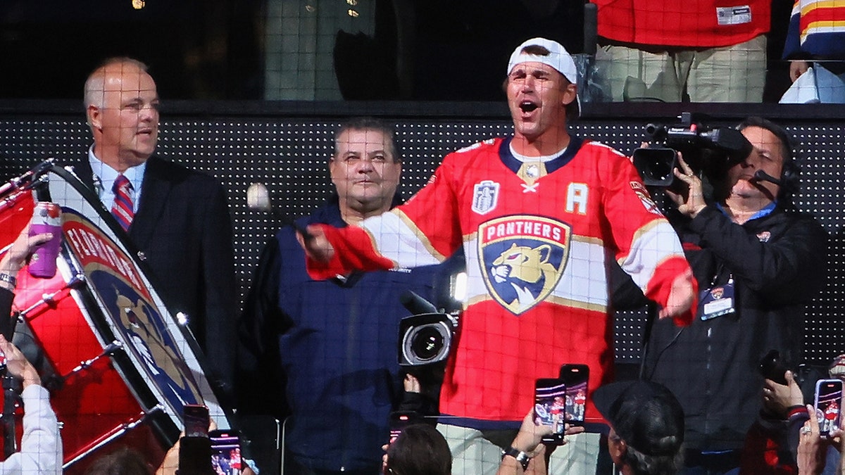 Golfer Brooks Koepka bangs a drum to start the game between the Florida Panthers and Vegas Golden Knights in Game 4 of the 2023 Stanley Cup Final at then-FLA Live Arena on June 10, 2023, in Sunrise, Florida.