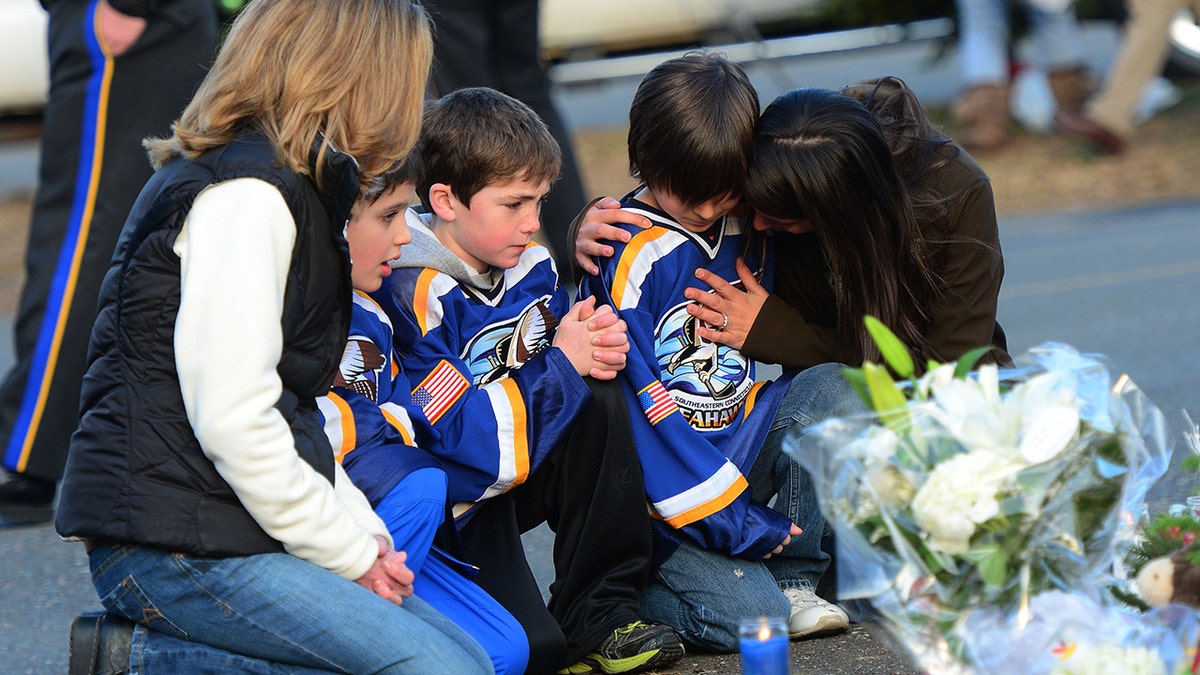 children and their parents pay tribute to sandy hook shooting victims