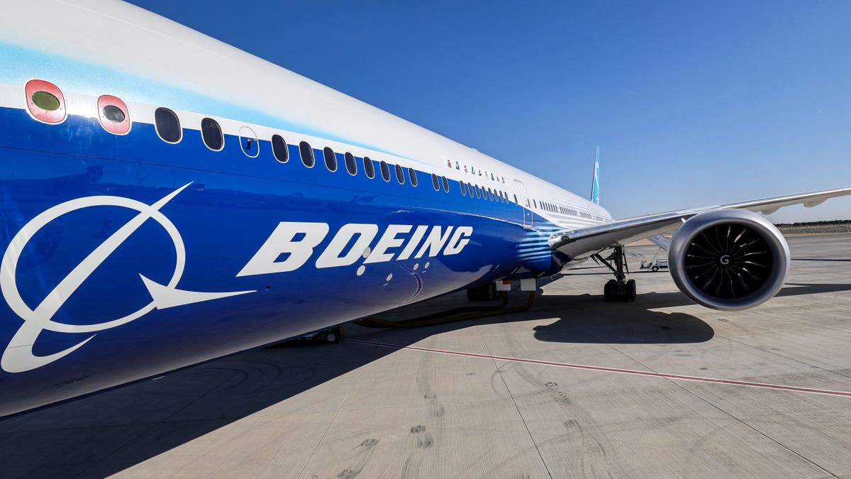 a view of the fuselage and one of the engines of a Boeing 777-9 jetliner