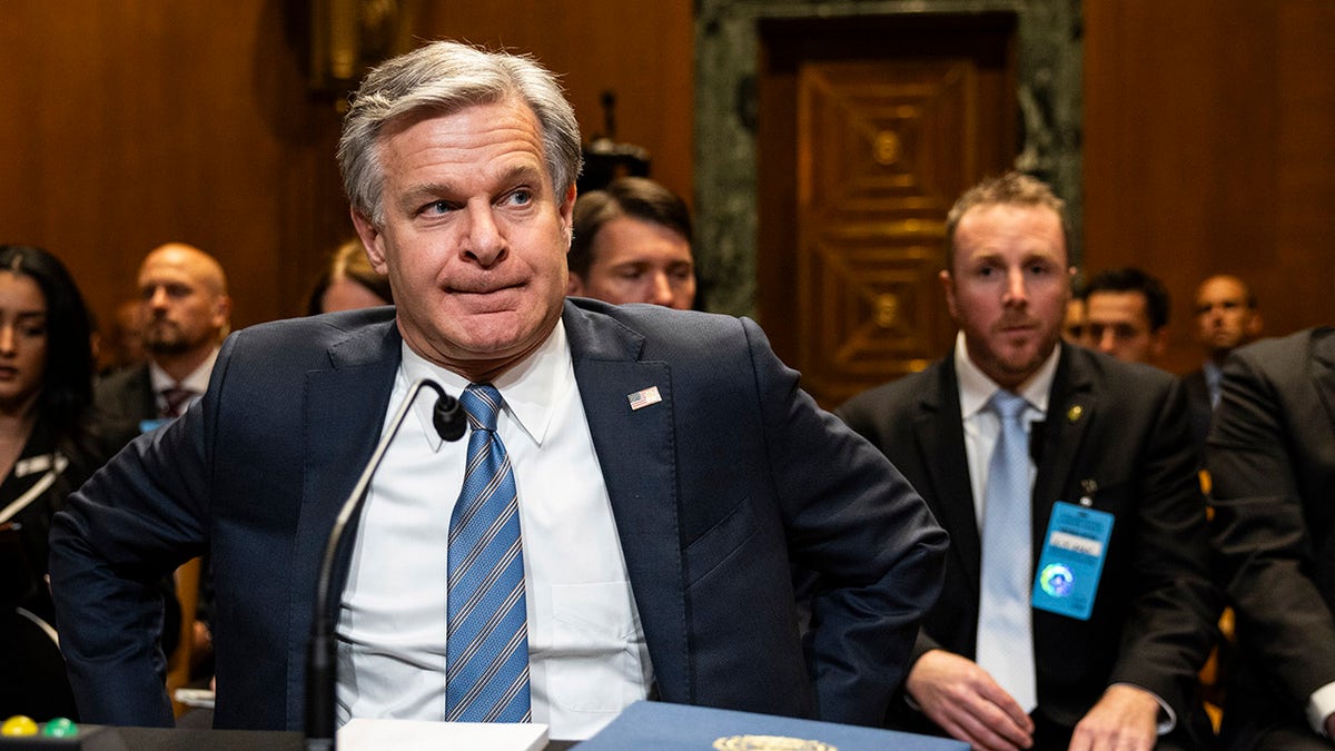 Wray sits to testify before the Senate