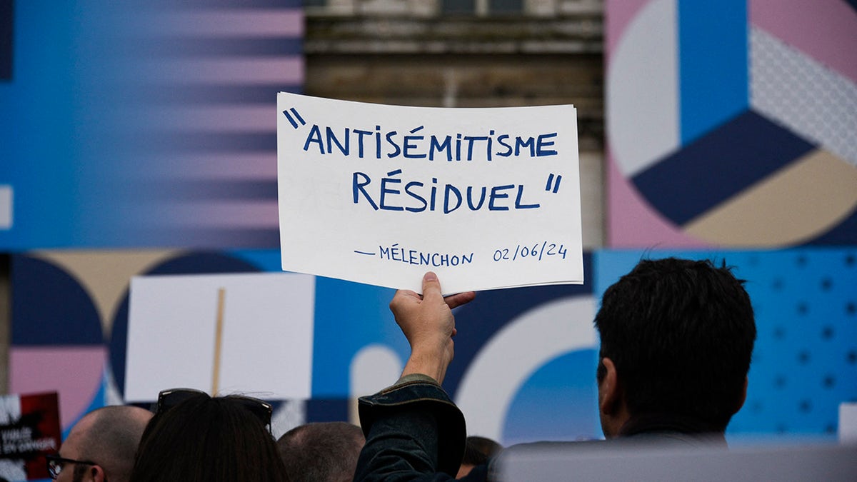 Sign against antisemitism at French protest