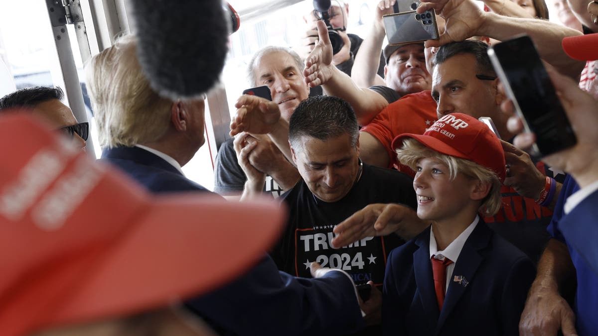 Trump meets young fan dressed as him