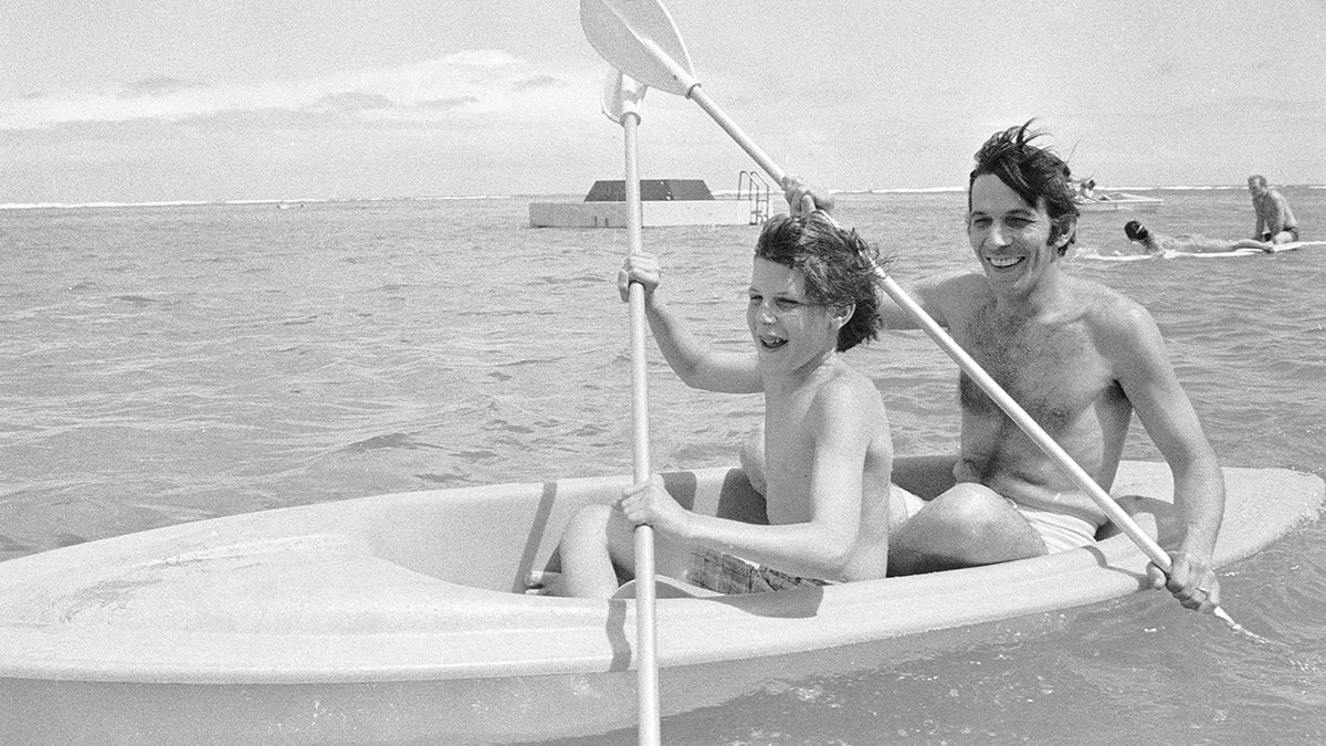Adam Nimoy and Leonard Nimoy rowing a boat.