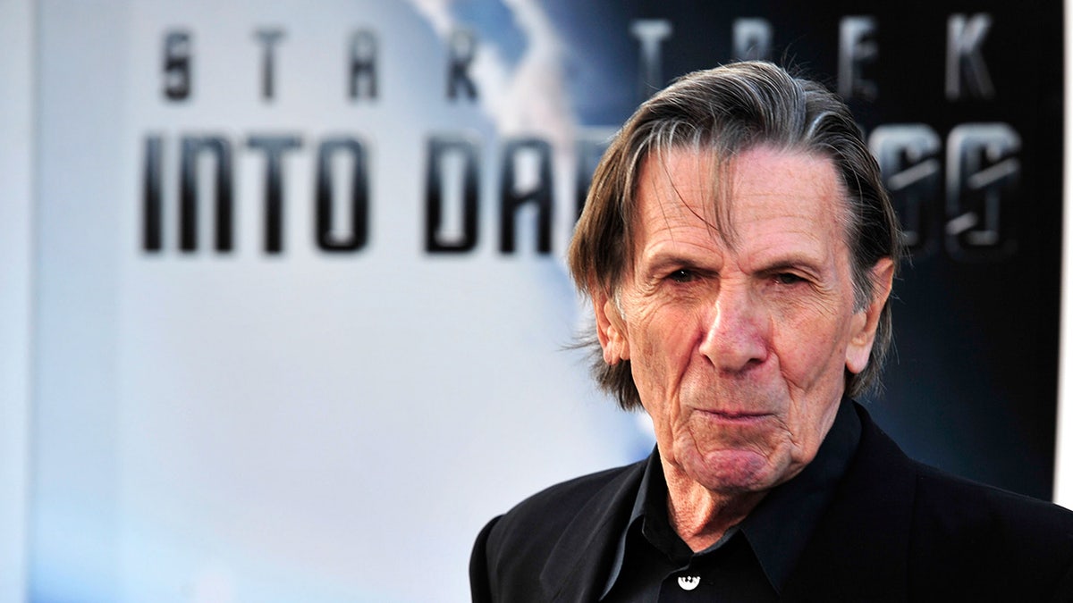 A close-up of Leonard Nimoy on the red carpet wearing black.