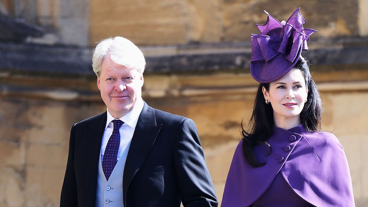 Earl Charles Spencer walks in Windsor alongside Karen Spencer in a purple outfit with a matching hat