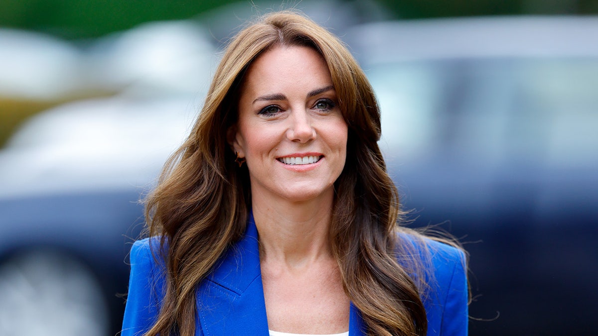 A close-up of Kate Middleton in a blue blazer.